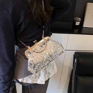 Elegant silver sequin shell evening clutch with gold handle and chain strap for women
