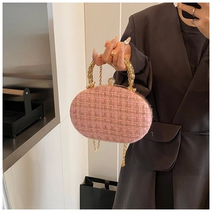 Pink tweed oval evening bag with gold chain and sparkling crystal clasp detail