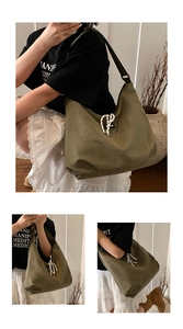 Detailed view of the olive green nylon tote bag featuring a decorative thick rope knot