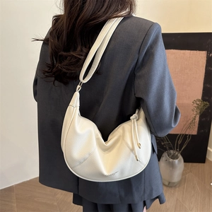 Chic cream white crescent shoulder bag with lychee texture and side drawstring detail