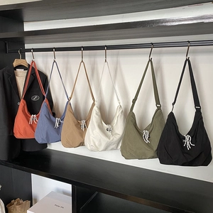 Minimalist canvas hobo bags with drawstring detail in six assorted vibrant colors