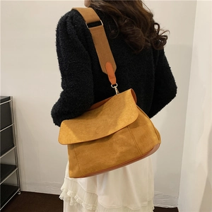 Chic mustard yellow suede crossbody bag with wide brown strap for women's daily commute