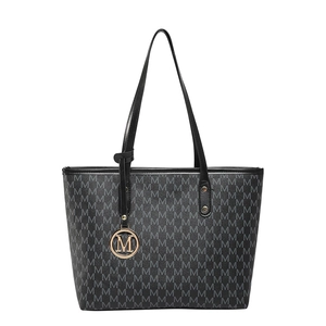 Classic black tote bag with M-pattern print and gold metal pendant on white background