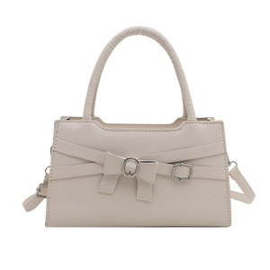 Elegant cream leather handbag with decorative bow and metal buckle detail for women