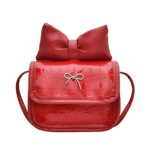 Mini red patent leather shoulder bag with crocodile texture and large bow detail