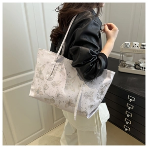 Close-up of butterfly print detail on a large aesthetic shoulder tote bag for women