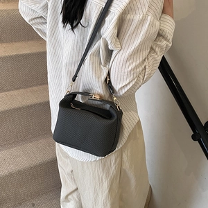 Black woven texture mini doctor handbag with gold hardware and shoulder strap