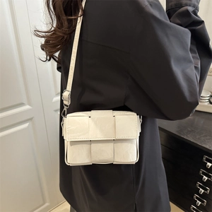 Chic white woven crossbody square bag with silver hardware for minimalist style
