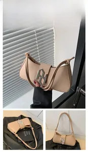 Detail of khaki leather handbag featuring an asymmetrical curve and knotted shoulder strap