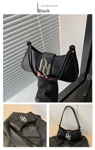 Detail shots of black crescent moon shoulder bag with large silver PD metal buckle