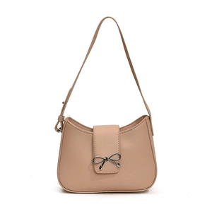Minimalist beige underarm bag with silver bow buckle and sleek faux leather finish