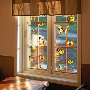 Creative butterfly window stickers in vibrant yellow and orange tones for home decoration