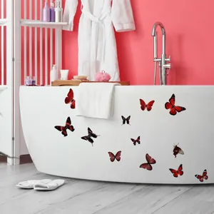 3D red and black butterfly window stickers on a white bathtub with a pink wall background