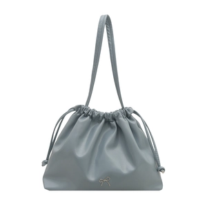 Light blue drawstring bucket bag with silver bow accent and slim double handles