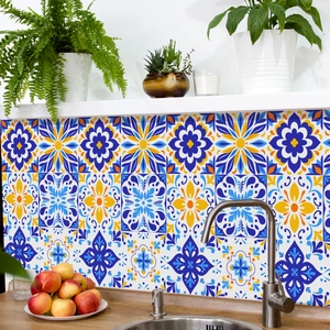 Close-up of blue and yellow mandala tile stickers as kitchen backsplash background