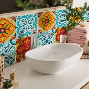 Moroccan style floral tile stickers applied on a bathroom vanity backsplash wall