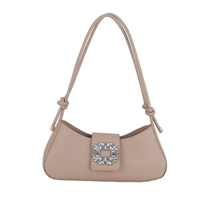 Beige leather baguette bag featuring a luxury crystal rectangle buckle and knot straps