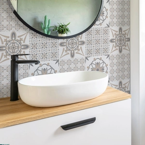 Moroccan retro marble pattern wall stickers behind a bathroom sink and faucet
