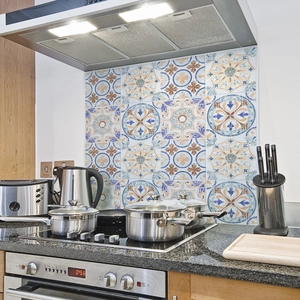 Detail of Mediterranean mandala pattern kitchen tile stickers in blue and orange hues