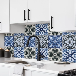 Detail of Mediterranean blue and white geometric tile stickers on kitchen backsplash
