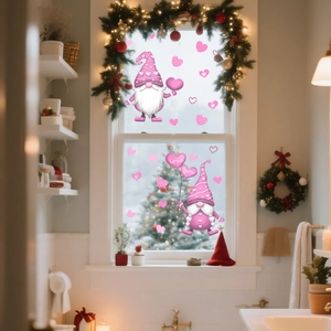 Close-up of pink Valentine's Gnomes window decals with love hearts on a glass surface
