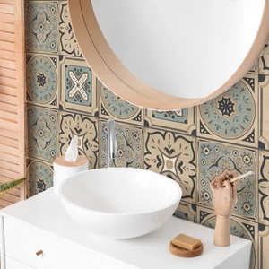 Detail of bohemian mandala tile stickers on a bathroom backsplash with a vintage pattern