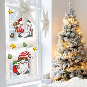 Detail of Christmas gnome window stickers with stars and trees in a cozy festive setting