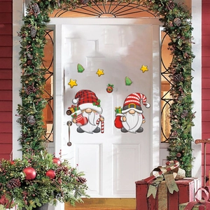 Detailed Christmas window stickers featuring cute gnomes and trees on a white door