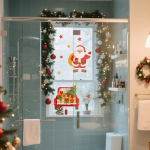 Detailed view of Santa and red truck static window decals on a glass shower door