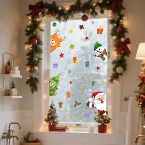 Christmas window stickers with Santa, snowman and reindeer on a festive bathroom glass
