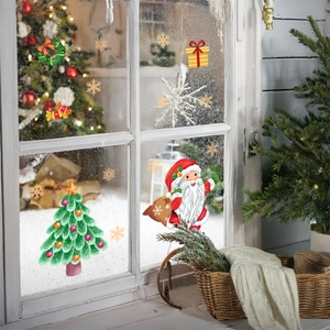 Close-up of Santa Claus and Christmas tree static window stickers on glass