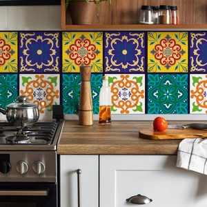 Detail of vintage waterproof tile stickers used as a kitchen backsplash behind a stove