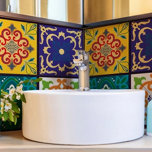 Close-up of Mediterranean floral tile stickers with colorful geometric patterns in bathroom