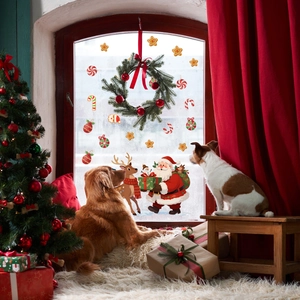 Festive Christmas window decals featuring Santa, reindeer and stars in a cozy home setting