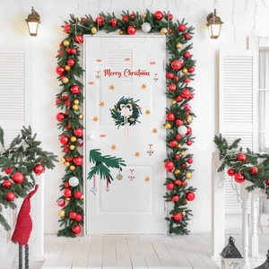 Detail of Merry Christmas window decals with festive wreaths and candy cane graphics