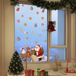 Detailed Christmas window decals featuring Santa, reindeer, and gingerbread man in cozy home