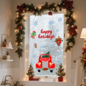 Detailed Christmas window decals showing happy holidays text and festive red truck designs