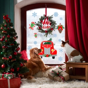 Cozy living room with dogs and Christmas window decals featuring a red vintage truck