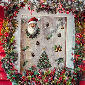 Christmas window decals with Santa Claus, Xmas tree, and pine cones on a snowy window