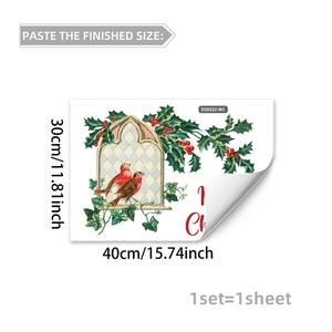 Detail of Christmas window sticker showing a red bird and holly with size measurements