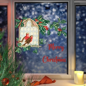 Close-up of vintage robin bird window decals with holly leaves and Merry Christmas text