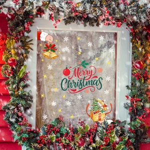 Creative Christmas window decals featuring Merry Christmas text, bells and snowflakes decorations