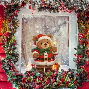 Sticker de fenêtre de Noël avec un ours mignon en costume de Père Noël et couronne festive