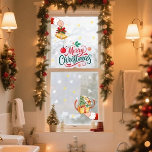 Detail of Merry Christmas window stickers with Santa Claus and festive gold stars decorations
