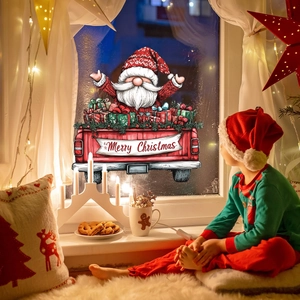 Détail du sticker de Noël avec le Père Noël dans un pick-up rouge rempli de cadeaux