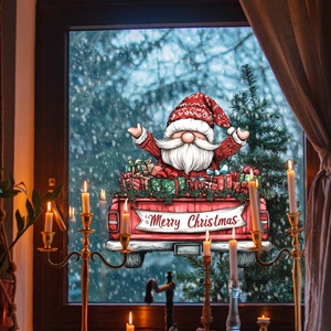 Détail d'un autocollant de fenêtre camion de Noël rouge avec Père Noël et cadeaux