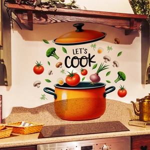 Detail of kitchen wall sticker with orange pot, floating ingredients and Let's Cook text