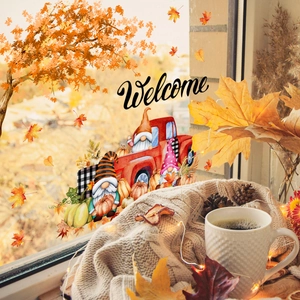 Autumn gnome window stickers with red truck and maple leaves in cozy home setting