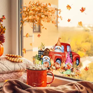 Autumn window decals showing gnomes, pumpkins, and a red truck on glass with cozy vibes