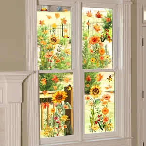 Close-up of autumn window decals featuring sunflowers, maple leaves, and butterflies